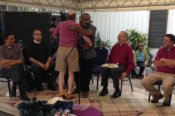 14. Bp Peter presents PNGCP's cassock to Bp Denny.jpg